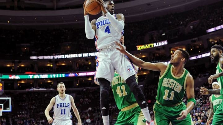 Mar 20, 2016; Philadelphia, PA, USA; Philadelphia 76ers forward Nerlens Noel (4) grabs a rebound during the first quarter of the game against he Boston Celtics at the Wells Fargo Center. Mandatory Credit: John Geliebter-USA TODAY Sports