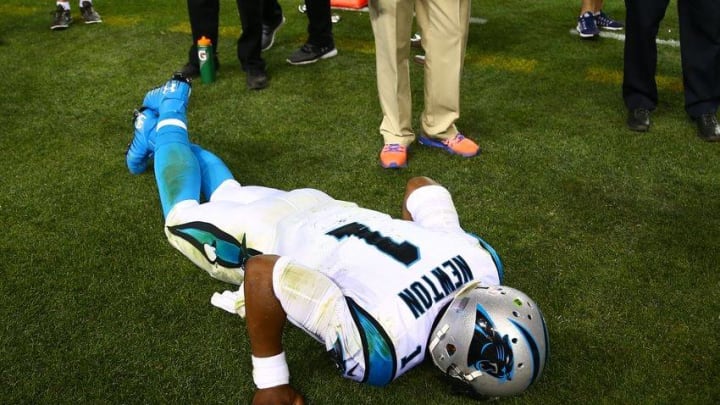 Sep 8, 2016; Denver, CO, USA; Carolina Panthers quarterback Cam Newton (1) reacts in pain on the sidelines after suffering an injury in the third quarter against the Denver Broncos at Sports Authority Field at Mile High. Mandatory Credit: Mark J. Rebilas-USA TODAY Sports
