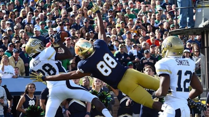 Sep 19, 2015; South Bend, IN, USA; Georgia Tech Yellow Jackets defensive back D.J. White (28) makes an interception against Notre Dame Fighting Irish wide receiver Corey Robinson (88) during the first half at Notre Dame Stadium. Mandatory Credit: Mike DiNovo-USA TODAY Sports