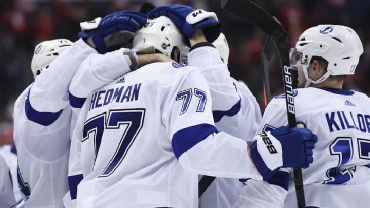 WASHINGTON, DC - MARCH 20: Victor Hedman #77 of the Tampa Bay Lightning celebrates with his teammates after scoring the game winning goal in overtime against the Washington Capitals at Capital One Arena on March 20, 2019 in Washington, DC. (Photo by Patrick McDermott/NHLI via Getty Images)