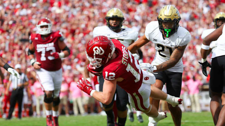 Oct 21, 2023; Norman, Oklahoma, USA; Oklahoma Sooners wide receiver Drake Stoops (12) dives for a touchdown during the fourth quarter against the UCF Knights at Gaylord Family-Oklahoma Memorial Stadium. Mandatory Credit: Kevin Jairaj-USA TODAY Sports