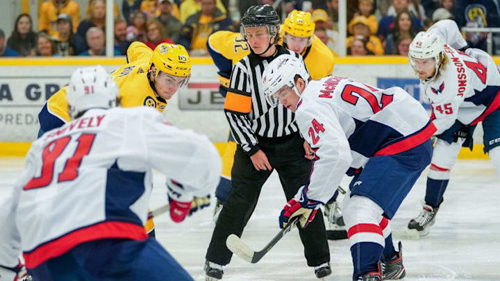 NASHVILLE, TN - SEPTEMBER 8: Refree Kelly Cooke drops the puck between Connor McMichael #24 of the Washington Capitals and Hugo Roy #65 of the Nashville Predators during an NHL Prospects game at Ford Ice Center on September 8, 2019 in Antioch, Tennessee. (Photo by John Russell/NHLI via Getty Images)