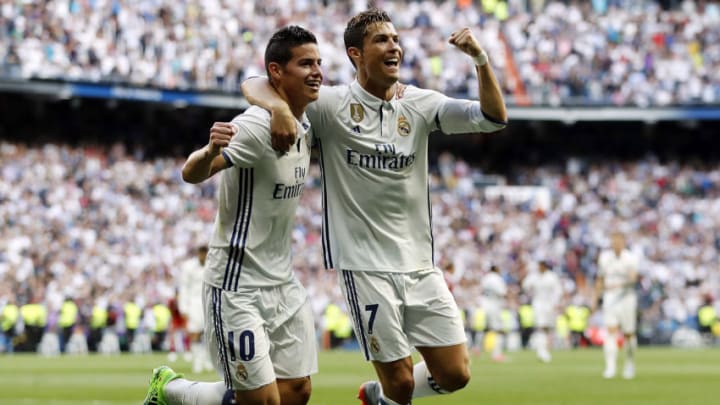 MADRID, SPAIN - MAY 14: Cristiano Ronaldo (R) of Real Madrid celebrates with James Rodriguez after scoring their team's second goal during the La Liga match between Real Madrid and Sevilla FC at Estadio Santiago Bernabeu on May 14, 2017 in Madrid, Spain. (Photo by Angel Martinez/Real Madrid via Getty Images)