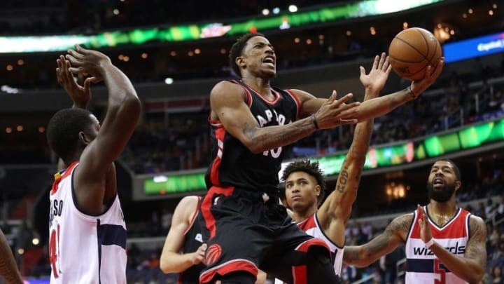 Nov 2, 2016; Washington, DC, USA; Toronto Raptors guard DeMar DeRozan (10) is fouled while shooting the ball by Washington Wizards forward Kelly Oubre Jr. (12) in the first quarter at Verizon Center. Mandatory Credit: Geoff Burke-USA TODAY Sports