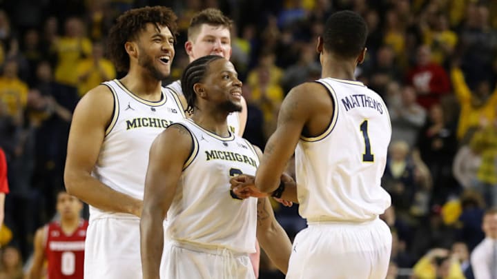 ANN ARBOR, MICHIGAN - FEBRUARY 09: Charles Matthews #1 of the Michigan Wolverines celebrates a second half basket with Zavier Simpson #3, Isaiah Livers #4 and Jon Teske #15 while playing the Wisconsin Badgers at Crisler Arena on February 09, 2019 in Ann Arbor, Michigan. Michigan won the game 61-52. (Photo by Gregory Shamus/Getty Images)