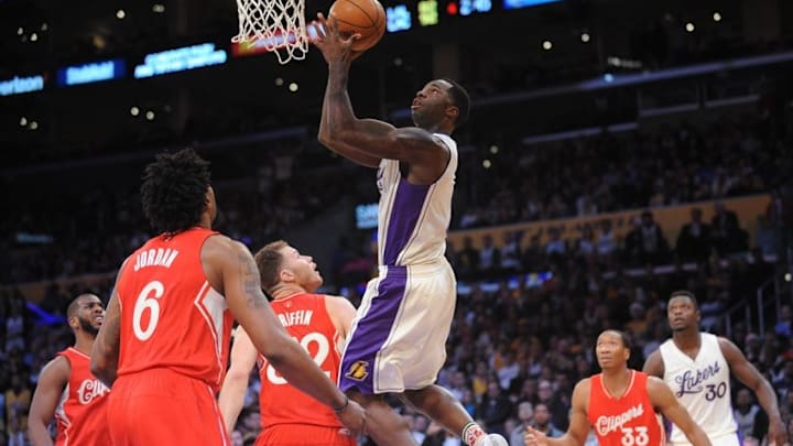 December 25, 2015; Los Angeles, CA, USA; Los Angeles Lakers forward Brandon Bass (2) moves in to score a basket against Los Angeles Clippers during the second half of an NBA basketball game on Christmas at Staples Center. Mandatory Credit: Gary A. Vasquez-USA TODAY Sports