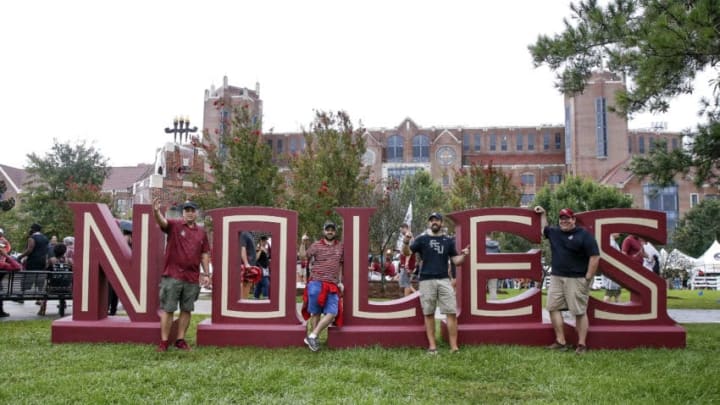 TALLAHASSEE, FL - SEPTEMBER 3: Florida State Seminoles fans pose in front of a NOLES sign before hosting the Virginia Tech Hokies at Doak Campbell Stadium on September 3, 2018 in Tallahassee, Florida. (Photo by Don Juan Moore/Getty Images)
