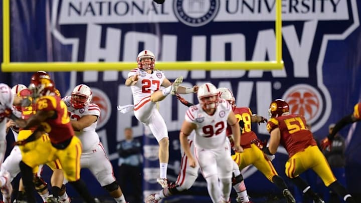 Dec 27, 2014; San Diego, CA, USA; Nebraska Cornhuskers punter Sam Foltz (27) punts during the second quarter against the USC Trojans in the 2014 Holiday Bowl at Qualcomm Stadium. Mandatory Credit: Jake Roth-USA TODAY Sports