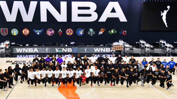 PALMETTO, FLORIDA - AUGUST 26: The Atlanta Dream, Washington Mystics, Minnesota Lynx, and the Los Angeles Sparks kneel on the court after the teams collectively decided to postpone games in protest of the shooting of Jacob Blake at Feld Entertainment Center on August 26, 2020 in Palmetto, Florida. Several sporting leagues across the nation today are postponing their schedules as players protest the shooting of Jacob Blake by Kenosha, Wisconsin police. NOTE TO USER: User expressly acknowledges and agrees that, by downloading and or using this photograph, User is consenting to the terms and conditions of the Getty Images License Agreement. (Photo by Julio Aguilar/Getty Images)