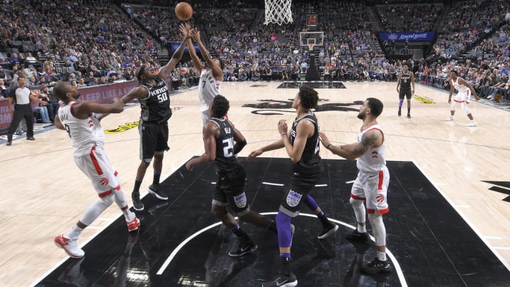 SACRAMENTO, CA – DECEMBER 10: Zach Randolph #50 of the Sacramento Kings rebounds against Kyle Lowry #7 of the Toronto Raptors on December 10, 2017 at Golden 1 Center in Sacramento, California. NOTE TO USER: User expressly acknowledges and agrees that, by downloading and or using this photograph, User is consenting to the terms and conditions of the Getty Images Agreement. Mandatory Copyright Notice: Copyright 2017 NBAE (Photo by Rocky Widner/NBAE via Getty Images)