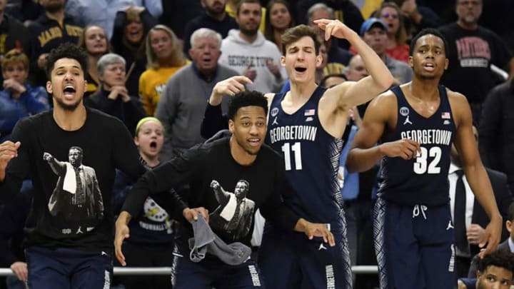 MILWAUKEE, WISCONSIN - MARCH 09: Greg Malinowski #11 of the Georgetown Hoyas and teammates react from the bench during the second half of the game against the Marquette Golden Eagles at Fiserv Forum on March 09, 2019 in Milwaukee, Wisconsin. (Photo by Quinn Harris/Getty Images)