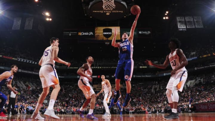 PHOENIX, AZ - DECEMBER 31: T.J. McConnell #12 of the Philadelphia 76ers shoots the ball against the Phoenix Suns on December 31, 2017 at Talking Stick Resort Arena in Phoenix, Arizona. NOTE TO USER: User expressly acknowledges and agrees that, by downloading and or using this photograph, user is consenting to the terms and conditions of the Getty Images License Agreement. Mandatory Copyright Notice: Copyright 2017 NBAE (Photo by Barry Gossage/NBAE via Getty Images)
