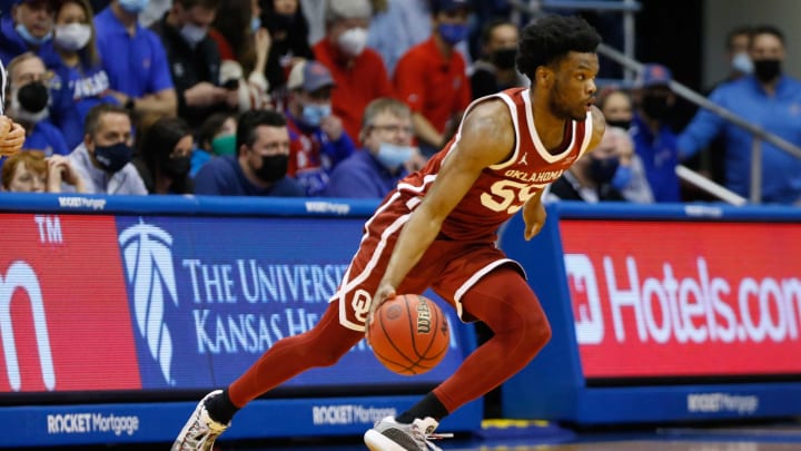 Oklahoma guard Elijah Harkless (55) dribbles around Kansas during the second half of Saturday’s game inside Allen Fieldhouse.