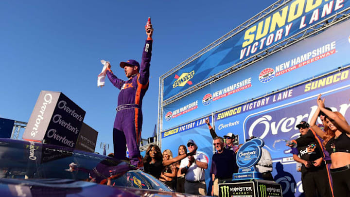 LOUDON, NH - JULY 16: Denny Hamlin, driver of the #11 FedEx Office Toyota, celebrates in Victory Lane after winning the Monster Energy NASCAR Cup Series Overton's 301 at New Hampshire Motor Speedway on July 16, 2017 in Loudon, New Hampshire. (Photo by Jared C. Tilton/Getty Images)