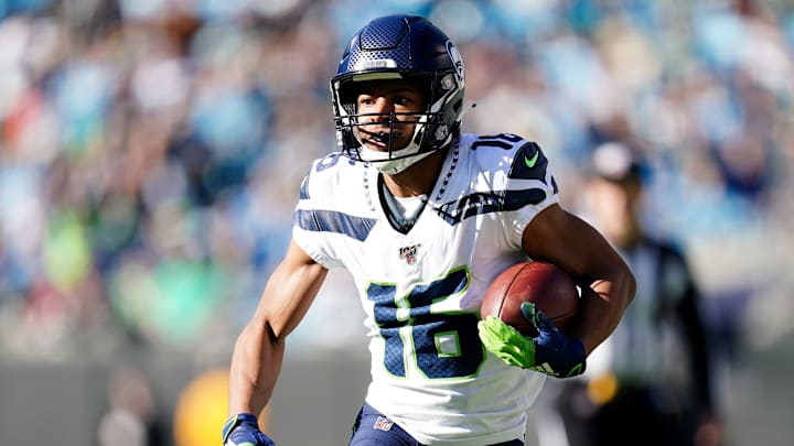 CHARLOTTE, NORTH CAROLINA – DECEMBER 15: Tyler Lockett #16 of the Seattle Seahawks runs with the ball during the first quarter during their game against the Carolina Panthers at Bank of America Stadium on December 15, 2019 in Charlotte, North Carolina. (Photo by Jacob Kupferman/Getty Images)