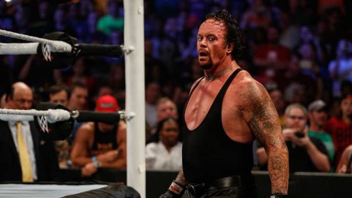 NEW YORK, NY - AUGUST 23: The Undertaker recovers during his fight against Brock Lesner at the WWE SummerSlam 2015 at Barclays Center of Brooklyn on August 23, 2015 in New York City. (Photo by JP Yim/Getty Images)