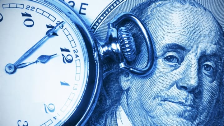 A pocketwatch and picture of Benjamin Franklin