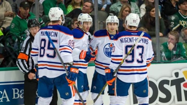 Nov 25, 2014; Dallas, TX, USA; Edmonton Oilers defenseman Martin Marincin (85) and left wing Taylor Hall (4) and right wing Jordan Eberle (14) and center Ryan Nugent-Hopkins (93) celebrate Hall