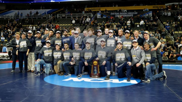 PITTSBURGH, PA - MARCH 23: Members and staff of the Penn State Nittany Lion wrestling team pose for a team photo after winning the team title of the NCAA Wrestling Championships on March 23, 2019 at PPG Paints Arena in Pittsburgh, Pennsylvania. (Photo by Hunter Martin/NCAA Photos via Getty Images)