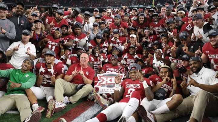 ARLINGTON, TX - DECEMBER 02: The Oklahoma Sooners pose for a team photo after winning the Big 12 Championship against the TCU Horned Frogs 41-17 at AT