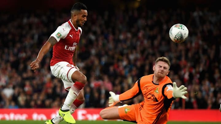 LONDON, ENGLAND - SEPTEMBER 20: Theo Walcott of Arsenal scores his sides first goal past Ian Lawlor of Doncaster Rovers during the Carabao Cup Third Round match between Arsenal and Doncaster Rovers at Emirates Stadium on September 20, 2017 in London, England. (Photo by Mike Hewitt/Getty Images)