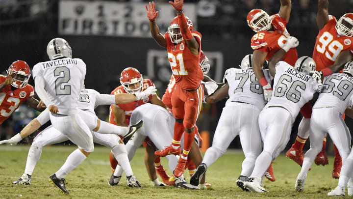 The Kansas City Chiefs’ Eric Murray (21) blocks a field goal attempt by Oakland Raiders kicker Giorgio Tavecchio (2) in the second quarter at the Coliseum in Oakland, Calif., on Thursday, Oct. 19, 2017. (John Sleezer/Kansas City Star/TNS via Getty Images)
