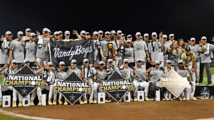 OMAHA, NE - JUNE 26: Players and coaches of the Vanderbilt Commodores celebrate after defeating the Michigan Wolverines to win the National Championship at the College World Series on June 26, 2019 at TD Ameritrade Park Omaha in Omaha, Nebraska. (Photo by Peter Aiken/Getty Images)