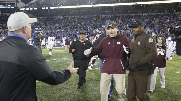 Oct 22, 2016; Lexington, KY, USA; Kentucky Wildcats head coach Mark Stoops and Mississippi State Bulldogs head coach Dan Mullen shake hands after the game at Commonwealth Stadium. Kentucky defeated Mississippi 40-38. Mandatory Credit: Mark Zerof-USA TODAY Sports