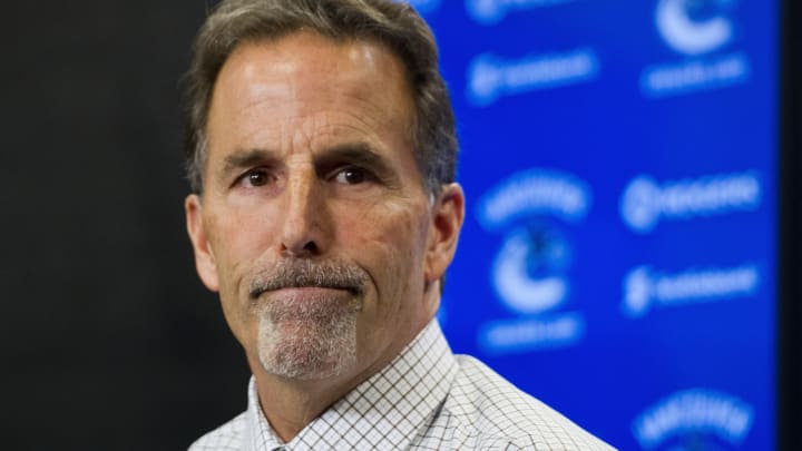 VANCOUVER, BC – NOVEMBER 23: John Tortorella Head Coach of the Vancouver Canucks reacts after answering a quesiton during the post game press conference after NHL action between the Chicago Blackhawks and the Vancouver Canucks on November 23, 2013 at Rogers Arena in Vancouver, British Columbia, Canada. (Photo by Rich Lam/Getty Images)