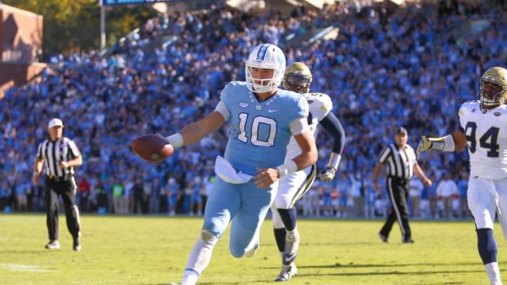 Nov 5, 2016; Chapel Hill, NC, USA; North Carolina Tar Heels quarterback Mitch Trubisky (10) scores a touchdown on his forth quarter run against the Georgia Tech Yellow Jackets at Kenan Memorial Stadium. The North Carolina Tar Heels defeated the Georgia Tech Yellow Jackets 48-20. Mandatory Credit: James Guillory-USA TODAY Sports