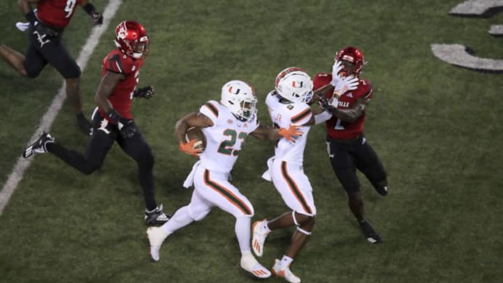LOUISVILLE, KENTUCKY - SEPTEMBER 19: Cam 'Ron Harris #23 of the Miami Hurricanes runs the ball against the Louisville Cardinals at Cardinal Stadium on September 19, 2020 in Louisville, Kentucky. (Photo by Andy Lyons/Getty Images)