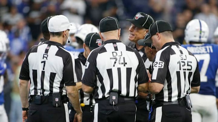 INDIANAPOLIS, INDIANA - SEPTEMBER 29: The officials huddle up during the game between the Oakland Raiders and the Indianapolis Colts at Lucas Oil Stadium on September 29, 2019 in Indianapolis, Indiana. (Photo by Justin Casterline/Getty Images)