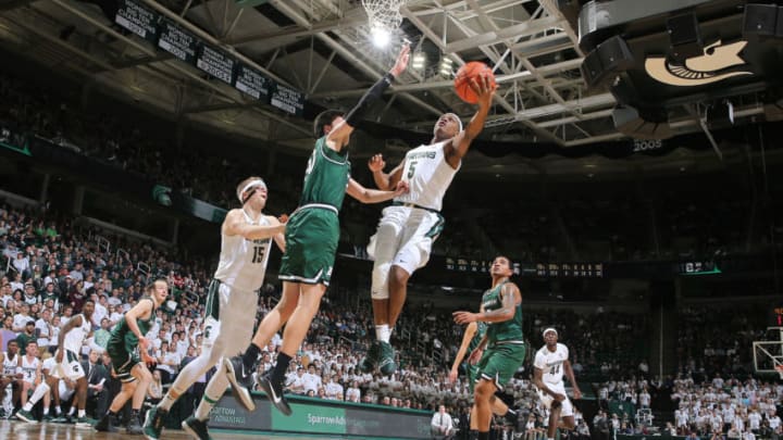 EAST LANSING, MI - NOVEMBER 10: Cassius Winston #5 of the Michigan State Spartans shoots a lay up against George Tinsley #20 of the Binghamton Bearcats in the second half at Breslin Center on November 10, 2019 in East Lansing, Michigan. (Photo by Rey Del Rio/Getty Images)