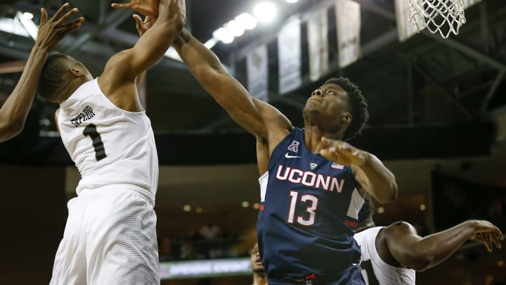 Feb 11, 2017; Orlando, FL, USA; UCF Knights guard B.J. Taylor (1) jumps for the rebound against Connecticut Huskies forward Steven Enoch (13) during the first half of an NCAA basketball game at CFE Federal Credit Union Arena. Mandatory Credit: Reinhold Matay-USA TODAY Sports