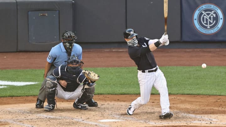 NEW YORK, NEW YORK - JULY 14: Clint Frazier #77 of the New York Yankees takes his at bat as Kyle Higashioka #66 of the New York Yankees catches during an intra squad game of summer workouts at Yankee Stadium on July 14, 2020 in the Bronx borough of New York City.Both players wore face coverings. (Photo by Elsa/Getty Images)