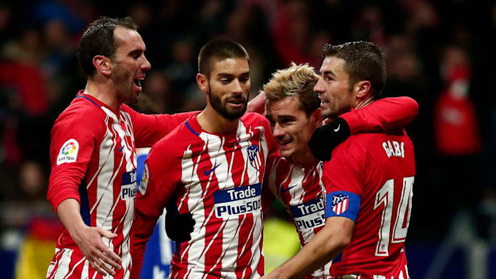 MADRID, SPAIN - DECEMBER 02: Antoine Griezmann (2ndR) of Atletico de Madrid celebrates scoring their second goal with teammates Gabi Fernandez (R); Yannick Carrasco (2ndL) and Diego Godin (L) during the La Liga match between Club Atletico Madrid and Real Sociedad de Futbol at Estadio Wanda Metropolitano on December 2, 2017 in Madrid, Spain. (Photo by Gonzalo Arroyo Moreno/Getty Images)