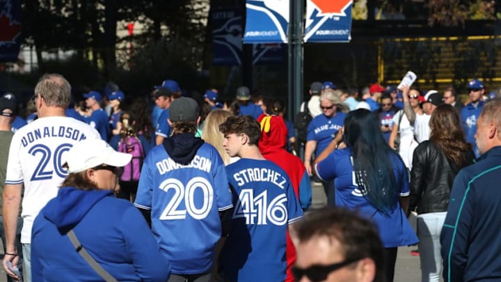 TORONTO, ON - OCTOBER 19: Toronto Blue Jays fans walk around outside of the park prior to game five of the American League Championship Series between the Toronto Blue Jays and the Cleveland Indians at Rogers Centre on October 19, 2016 in Toronto, Canada. (Photo by Tom Szczerbowski/Getty Images)