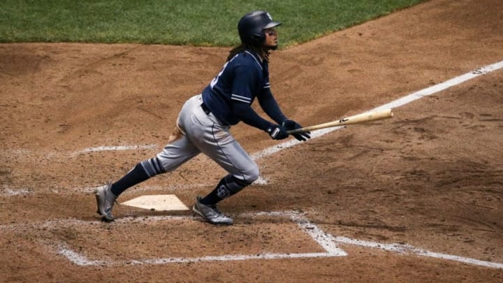 MILWAUKEE, WI - AUGUST 09: Freddy Galvis #13 of the San Diego Padres hits a home run in the sixth inning against the Milwaukee Brewers at Miller Park on August 9, 2018 in Milwaukee, Wisconsin. (Photo by Dylan Buell/Getty Images)