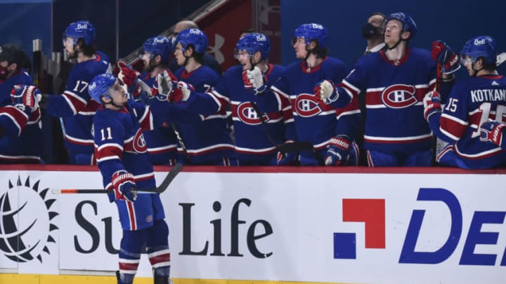 MONTREAL, QC - FEBRUARY 04: Brendan Gallagher #11 of the Montreal Canadiens celebrates a first period goal with teammates on the bench against the Ottawa Senators during the first period at the Bell Centre on February 4, 2021 in Montreal, Canada. (Photo by Minas Panagiotakis/Getty Images)