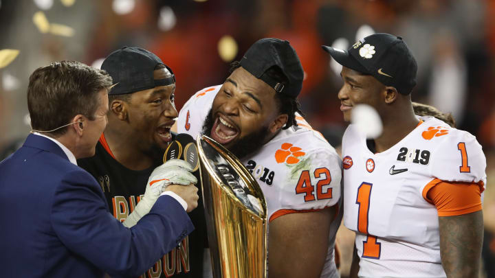 SANTA CLARA, CA – JANUARY 07: Christian Wilkins #42 of the Clemson Tigers celebrates with the trophy after his teams 44-16 win over the Alabama Crimson Tide in the CFP National Championship presented by AT&T at Levi’s Stadium on January 7, 2019 in Santa Clara, California. (Photo by Sean M. Haffey/Getty Images)