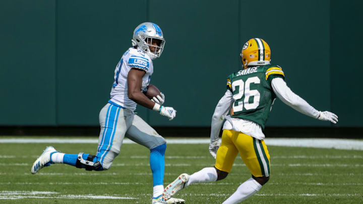 GREEN BAY, WISCONSIN - SEPTEMBER 20: Kerryon Johnson #33 of the Detroit Lions runs with the ball while being chased by Darnell Savage #26 of the Green Bay Packers in the second quarter at Lambeau Field on September 20, 2020 in Green Bay, Wisconsin. (Photo by Dylan Buell/Getty Images)