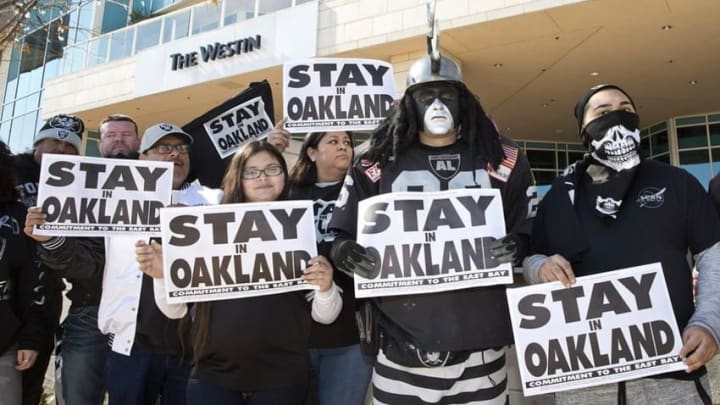 Jan 12, 2016; Houston, TX, USA; Oakland Raiders fans hold signs supporting their team while owners met at the 2016 NFL owners meeting at the Westin Houston. Mandatory Credit: Thomas B. Shea-USA TODAY Sports