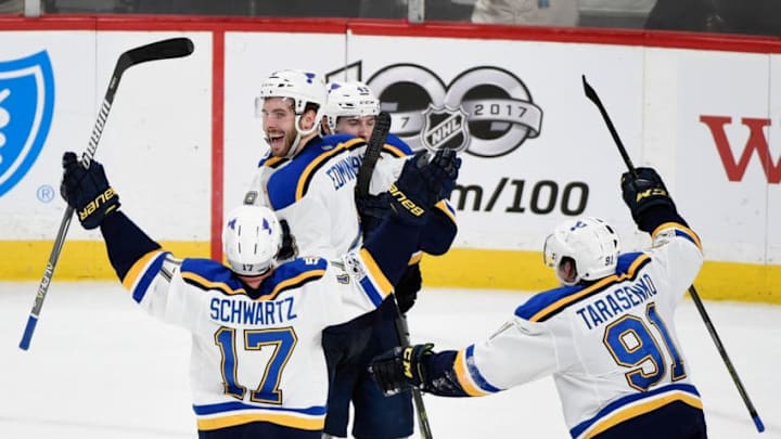 ST PAUL, MN - APRIL 12: Jaden Schwartz #17, Ivan Barbashev #49 and Vladimir Tarasenko #91 of the St. Louis Blues congratulate teammate Joel Edmundson #6 on scoring the game-winning goal against the Minnesota Wild during the overtime period in Game One of the Western Conference First Round during the 2017 NHL Stanley Cup Playoffs at Xcel Energy Center on April 12, 2017 in St Paul, Minnesota. The Blues defeated the Wild 2-1 in overtime. (Photo by Hannah Foslien/Getty Images)