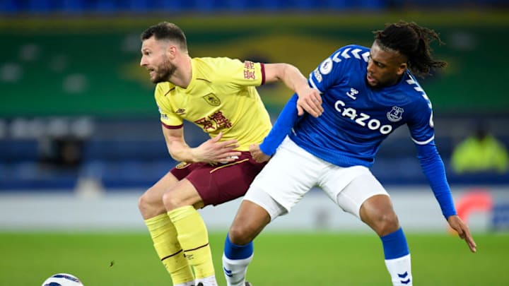 LIVERPOOL, ENGLAND - MARCH 13: Erik Pieters of Burnley battles for possession with Alex Iwobi of Everton during the Premier League match between Everton and Burnley at Goodison Park on March 13, 2021 in Liverpool, England. Sporting stadiums around the UK remain under strict restrictions due to the Coronavirus Pandemic as Government social distancing laws prohibit fans inside venues resulting in games being played behind closed doors. (Photo by Peter Powell - Pool/Getty Images)