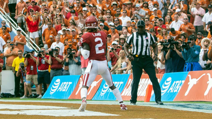 DALLAS, TX - OCTOBER 06: Oklahoma Sooners wide receiver CeeDee Lamb (2) scores a touchdown during the Red River Showdown between the Oklahoma Sooners and the Texas Longhorns on October 6, 2018, at the Cotton Bowl in Dallas, Texas. (Photo by John Korduner/Icon Sportswire via Getty Images)