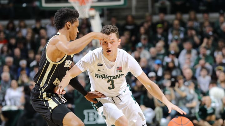 EAST LANSING, MI – DECEMBER 29: Foster Loyer #3 of the Michigan State Spartans handles the ball while defended by B. Artis White #3 of the Western Michigan Broncos in the first half at Breslin Center on December 29, 2019 in East Lansing, Michigan. (Photo by Rey Del Rio/Getty Images)