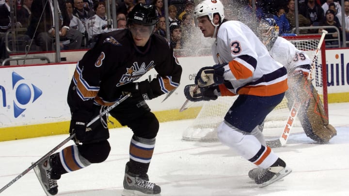 WASHINGTON – OCTOBER 13: Alexander Ovechkin #8 of the Washington Capitals spins away from defenseman Brent Sopel #3 of the New York Islanders at the MCI Center on October 13, 2005 in Washington, DC. (Photo by Greg Fiume/Getty Images)