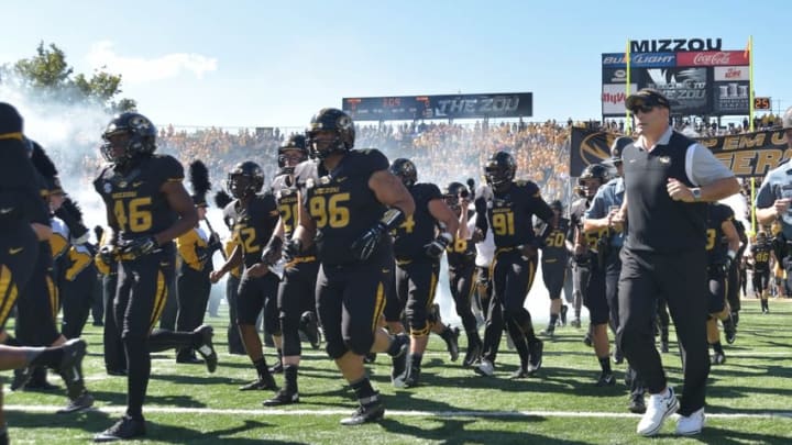 Sep 19, 2015; Columbia, MO, USA; Missouri Tigers head coach Gary Pinkel and players run onto the field before the game against the Connecticut Huskies at Faurot Field. Missouri won 9-6. Mandatory Credit: Denny Medley-USA TODAY Sports
