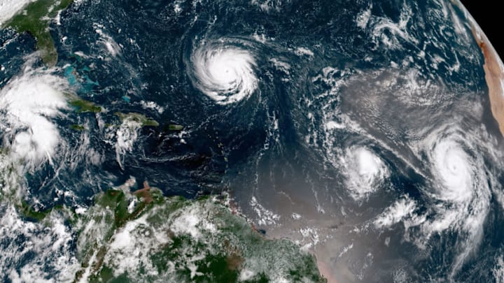 ATLANTIC OCEAN - SEPTEMBER 10: In this NOAA satellite handout image, shows Hurricane Florence (C) as it gains strength in the Atlantic Ocean southeast of Bermuda moving west on September 10, 2018. Hurricane Isaac and Helene can be seen to the east of Florence. Weather predictions say the storm will likely hit the U.S. East Coast as early as Thursday, September 13 bringing massive winds and rain. (Photo by NOAA via Getty Images)