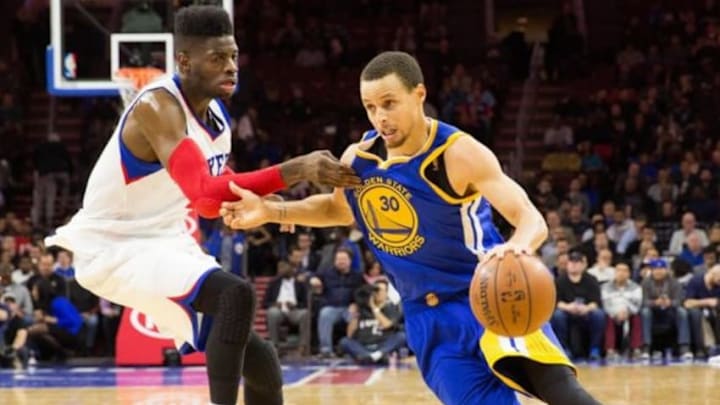 Feb 9, 2015; Philadelphia, PA, USA; Golden State Warriors guard Stephen Curry (30) drives past Philadelphia 76ers center Nerlens Noel (4) during the second half at Wells Fargo Center. The Warriors defeated the 76ers 89-84. Mandatory Credit: Bill Streicher-USA TODAY Sports